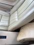 Interior view of a 1970 Chevrolet Corvette featuring light beige leather seats with horizontal stitching and a console in a similar shade