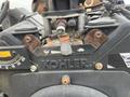 A close-up of the control panel of a 2014 Vermeer Corporation Sweep Stump Cutter showing a Kohler logo and various dials and levers for operation