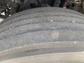 Close-up of a worn tire from a 2017 Freightliner M2 106 showing visible tread wear and detailing of the rubber surface