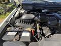 Engine compartment of a 2017 Ford F-350 SD showing the air intake and battery with visible cables and battery terminals