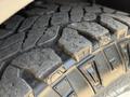 Close-up of a rugged tire tread on a 2017 Ford Transit showing deep grooves and a textured surface designed for traction