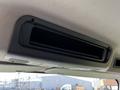 A vent located on the ceiling of a 2016 Freightliner M2 106 truck's cab with control buttons nearby