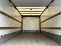 Interior view of a 2018 Hino 195 truck with wooden side panels and a wooden floor showing an empty cargo area
