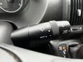 A close-up of the windshield wiper control lever in a 2018 RAM Promaster showing mist and trip reset functions