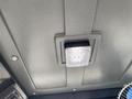 A square LED light mounted on the ceiling of a 2024 AGT Industrial QH13R Mini Excavator cabin