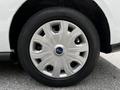 A silver alloy wheel with a blue Ford logo in the center and a black tire, designed for a 2019 Ford Transit Connect