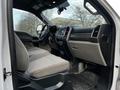 Interior of a 2017 Ford F-550 with a driver's seat visible and dashboard featuring controls and infotainment system