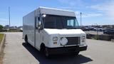 White 2011 Ford Econoline with a flat front and large cargo area parked on a pavement