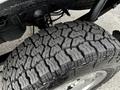 Close-up of the tread pattern on a tire from a 2016 Ford F-150 showcasing its rugged design and deep grooves for traction