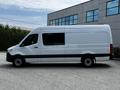 A white 2019 Mercedes-Benz Sprinter van shown from the side with a long cargo area and black trim along the bottom
