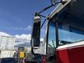 A 1994 Volvo FE 42 truck with a prominent side mirror and additional mirror for visibility