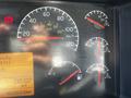 Dashboard of a 2005 Volvo VND 122 showing speedometer fuel gauge and various warning lights