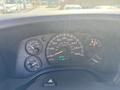 Dashboard of a 2007 Chevrolet Express featuring a speedometer fuel gauge and various warning lights with odometer reading of 68988 miles
