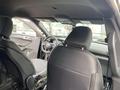 Interior view of a 2021 Ford Explorer showcasing the front seats and dashboard with steering wheel visible