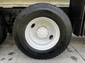 Close-up of a Michelin tire mounted on a 2017 International WorkStar 7600 featuring a silver wheel rim and tread pattern XDE MATIC 11R22.5
