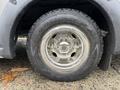A close-up of a shiny chrome wheel with a Goodyear tire from a 2020 Chevrolet Express van