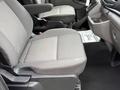 Interior of a 2022 Ford Transit showing driver's seat and passenger seat with fabric upholstery in gray tones