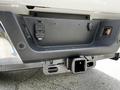 Close-up of the rear hitch receiver on a 2020 Ford F-350 Super Duty with integrated connectors and lighting features