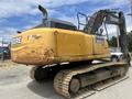 A yellow 2018 John Deere 350G excavator with a distinctively large upper body and tracks for mobility on construction sites