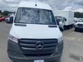 A 2022 Mercedes-Benz Sprinter van with a white exterior and the signature three-pointed star logo on the front grille