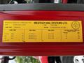 A yellow identification label attached to a vehicle featuring specifications such as weight, tire sizes, and manufacturer details for a 2011 International 4400