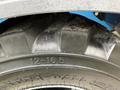 Close-up of a tire on a 2020 Genie GTH-5519 featuring a deep tread pattern and labeled with the size 12-16.5 and the brand Extra-Wall