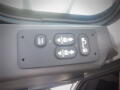 Control panel with buttons for locking and unlocking, marked with arrows indicating up and down functions on a 2016 International WorkStar 7500