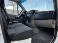 Interior view of a 2012 Mercedes-Benz Sprinter showcasing the driver's seat dashboard and controls