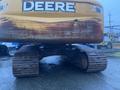 A yellow 2014 John Deere 350G excavator with visible tracks and a worn exterior, featuring the DEERE logo prominently displayed on the side