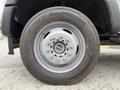 A close-up of a wheel from a 2020 Ford F-550 featuring a grey rim and a tire labeled Continental ContiHybrid HS3 with visible tread pattern