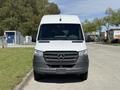 A 2023 Mercedes-Benz Sprinter van in white with a simple front design featuring the Mercedes-Benz emblem on the grille and large windshield