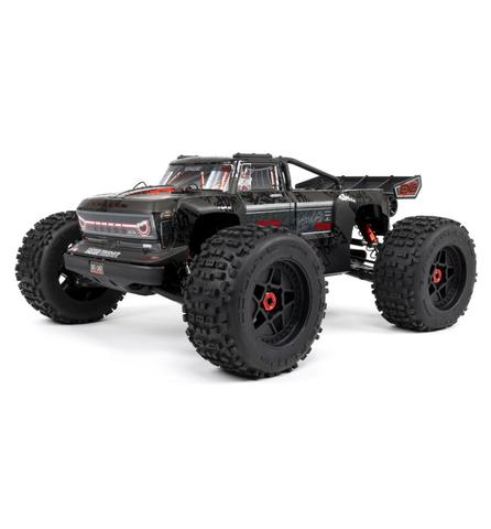 Arrma Outcast 8S BLX EXB Brushless RTR 1/5 4WD Stunt Truck in black featuring large tires a detailed front grill and a sturdy frame