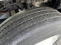 Close-up of a tire from a 2013 International Durastar 4300 showing tread wear and details of the rubber surface