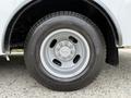 A close-up view of a gray wheel and tire from a 2019 Chevrolet Express with a five-spoke wheel design and an all-season tread pattern