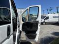 A white 2016 RAM Promaster van with its front driver's side door open