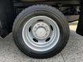 A close-up of the wheel of a 2016 Ford F-550 featuring a silver alloy rim and a Michelin tire with visible tread pattern