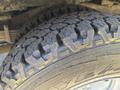 Close-up of a rugged tire tread from a 2020 Chevrolet Express showcasing deep grooves and an aggressive pattern designed for traction and durability