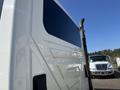 A 2007 International 7300 truck with a white exterior and streamlined design features visible on its side panel