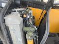 A 2013 JCB 510-56 Loadall showcasing hydraulic components and connections with visible labeling and hoses