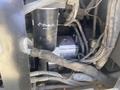 A 2010 Trackless MT6 with visible mechanical components including a filter and wires in a close-up view