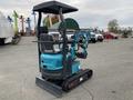 A teal 2024 AGT Mini Excavator with a covered operator's seat and a front digging bucket on tracks