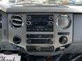 Dashboard of a 2016 Ford F-550 featuring audio controls air vents climate controls and various switches