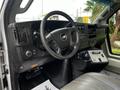 Interior view of a 2017 Chevrolet Express showing the steering wheel dashboard and control panel with various buttons and gauges