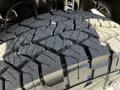 Close-up of a textured tire tread from a 2017 Mercedes-Benz Sprinter showcasing deep grooves and a rugged design for enhanced traction