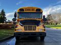 2005 Blue Bird school bus with a yellow exterior featuring a black front grille and large windows designed for passenger seating