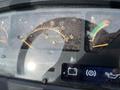 Dashboard of a 2003 John Deere 790 showing various gauges including fuel level engine temperature and hour meter