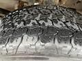 Close-up of a tire tread from a 2016 Ford F-150 showing detailed patterns and wear on the rubber surface