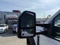 Close-up of the side mirror of a 2022 Ford F600 showing a sleek design and dual reflective surfaces
