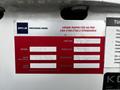 A red and white inspection label detailing a 2008 International 7500 model with information on unit number serial number and technician name