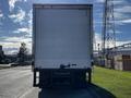 A 2016 Freightliner M2 106 box truck viewed from the rear with a white exterior and no visible markings